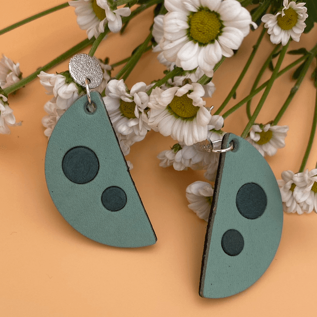 Teal spotted semi circle leather earrings 